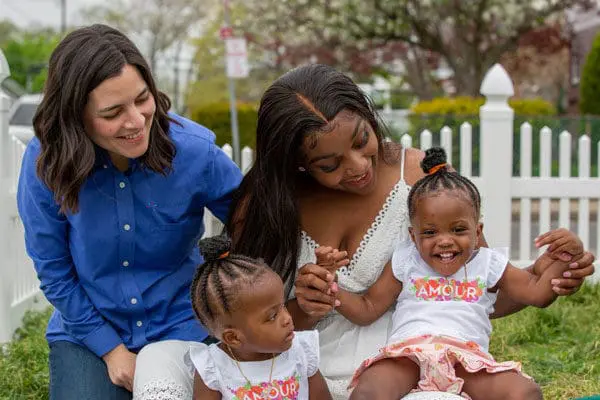 A VNS Health Nurse Family Partnership nurse with a mother and her twin toddlers.