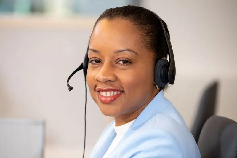 VNS Health team member Chrystal Bowen wearing a headset.
