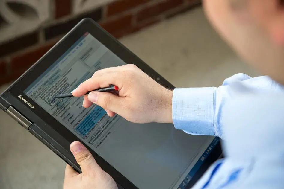 A VNS Health team member using a tablet.