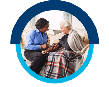 A VNS Health nurse taking her patient's blood pressure.