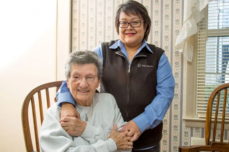 A VNS Health nurse and her elderly patient.