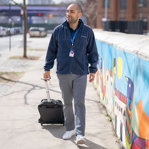 A VNS Health team member walking in the community.