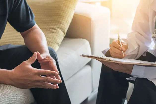 A doctor consulting with a caregiver.