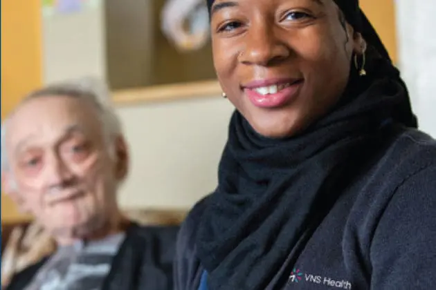A VNS Health care worker and patient