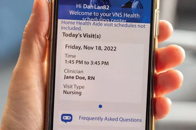 hand holding phone showing my home care app main screen
