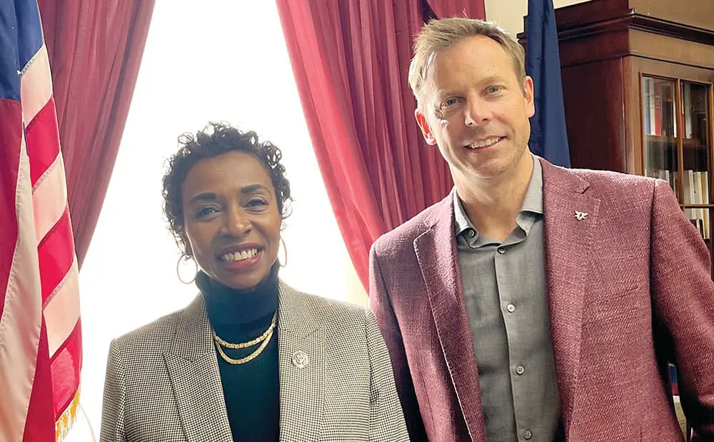 yvette clark and dan savitt smiling together  