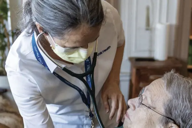 VNS Health team member checking older patient