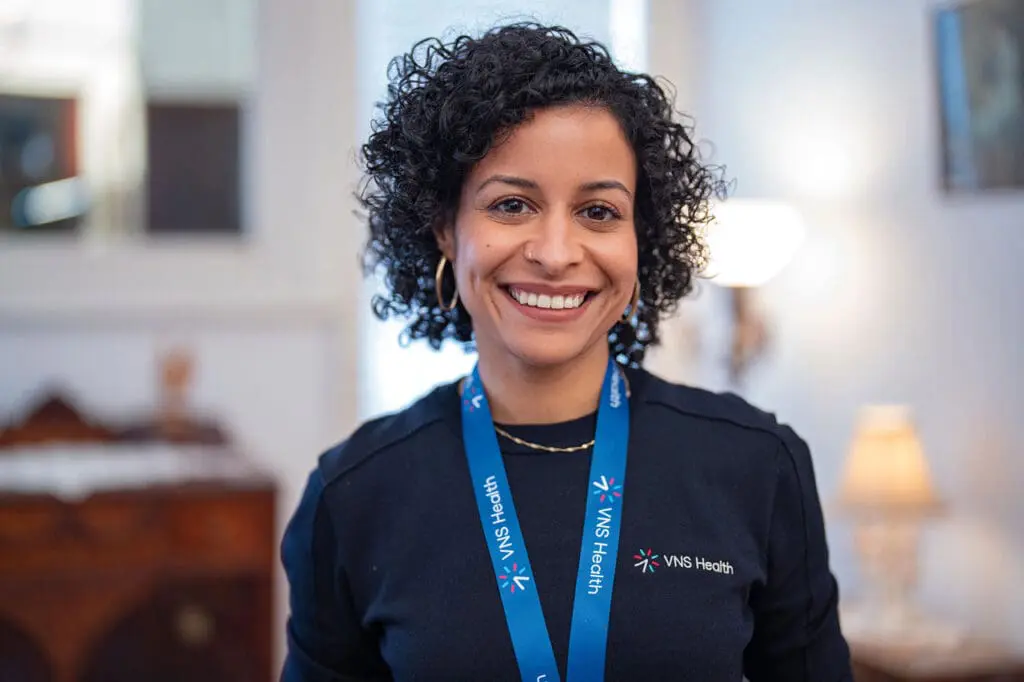 A clinician at VNS Health smiling.