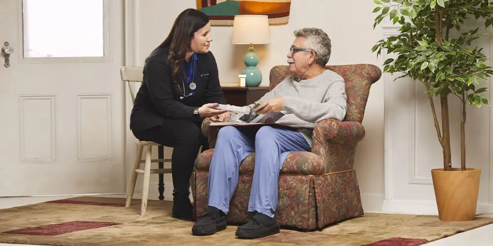 A VNS Health nurse helps a behavioral health patient with his medications.