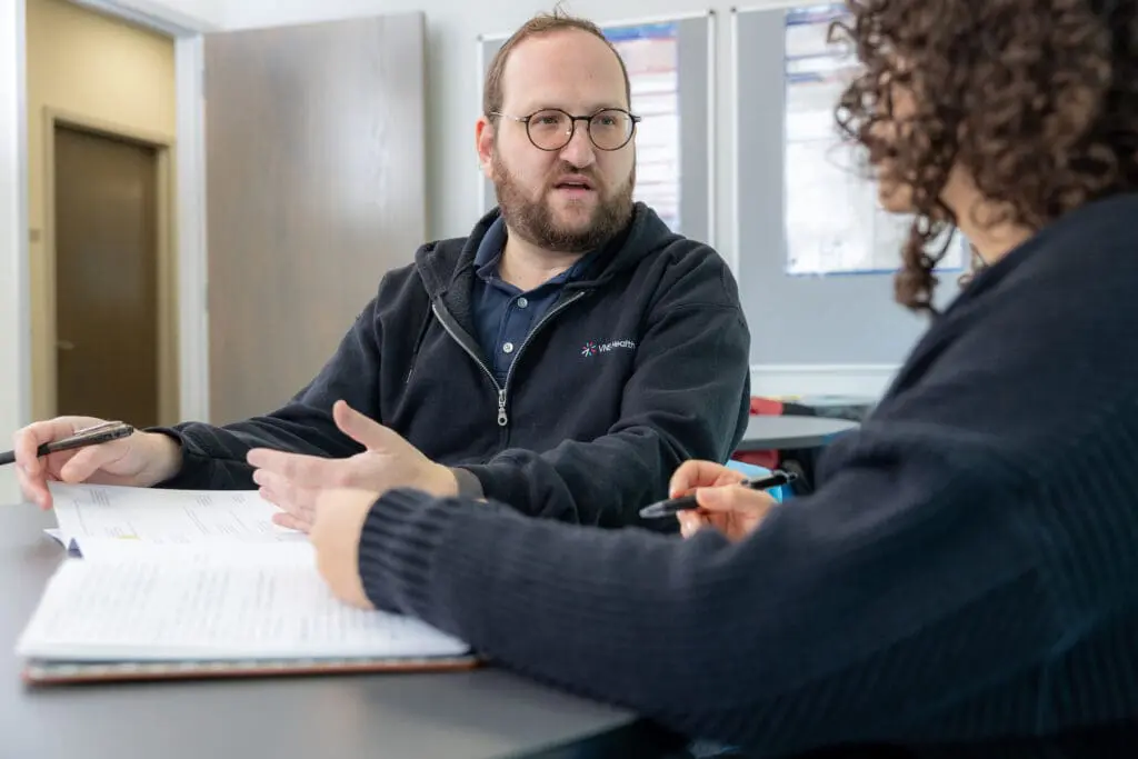 VNS Health team member talking with patient about hospice care.
