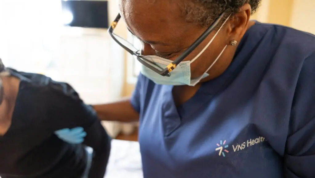 VNS Health home health aide caring for hospice patient