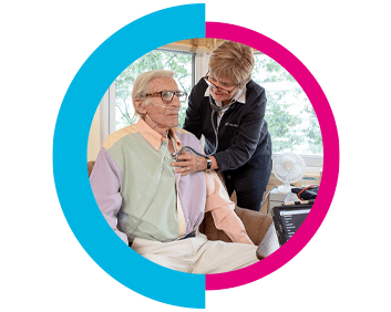 A VNS Health home health aide listening to her patient's heartbeat.
