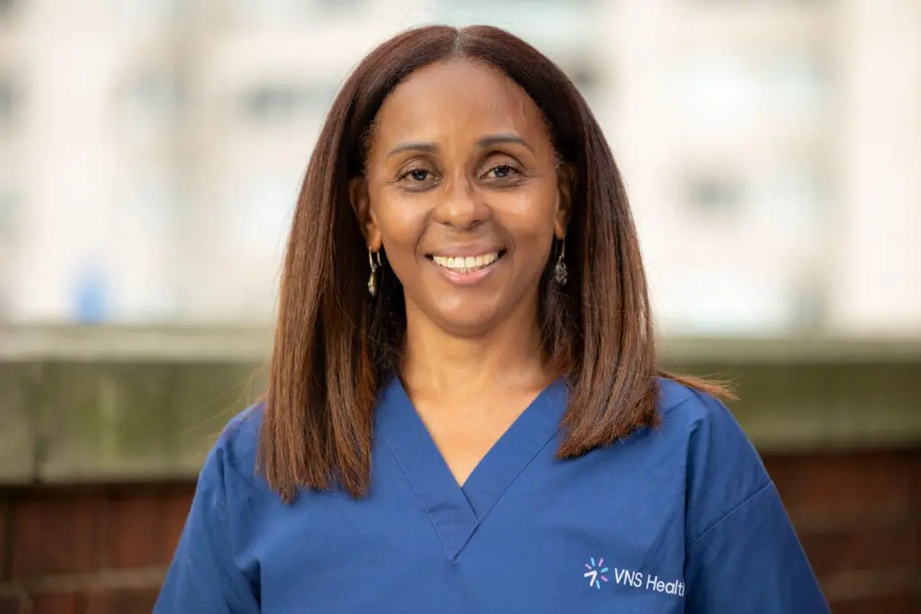 VNS Health home health aide Arcina Batista smiling.