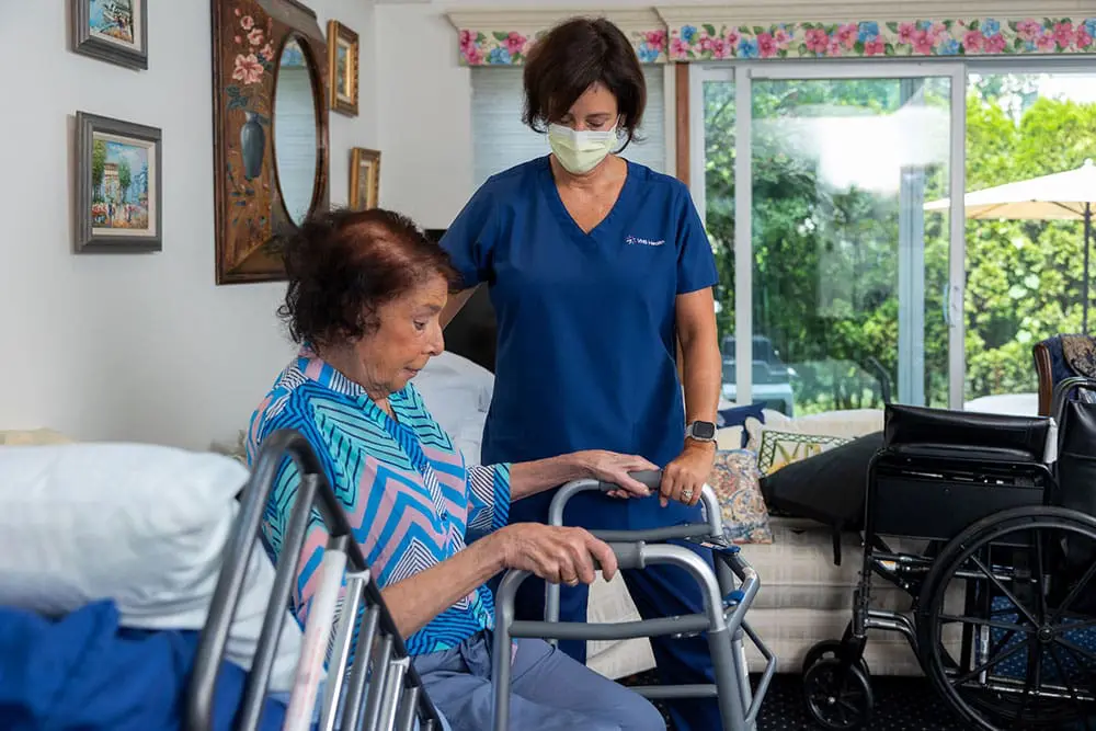 A nurse assists a patient