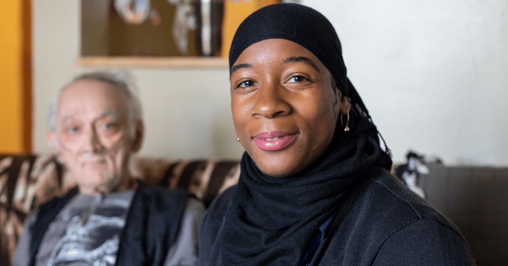 VNS Health hospice nurse sitting with patient