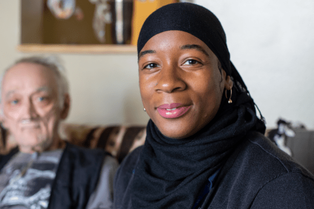 VNS Health hospice nurse sitting with patient