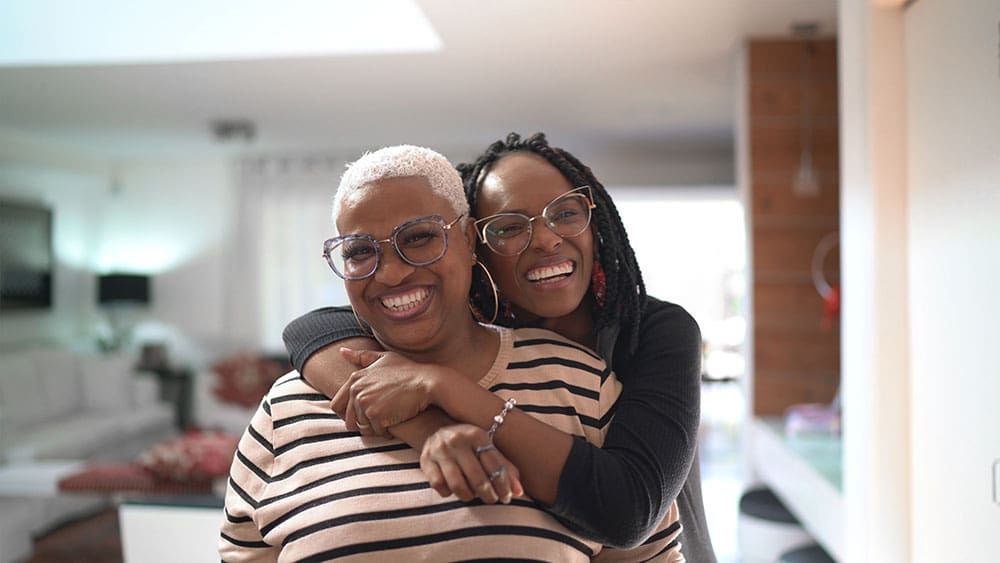 woman hugging another woman