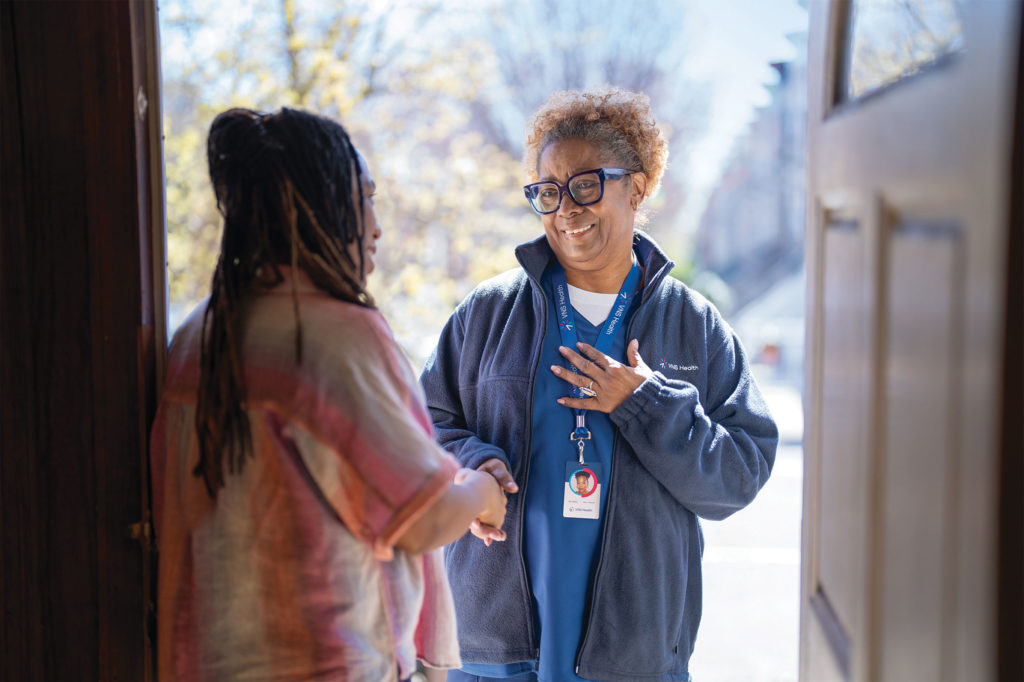 a VNS Health employee is greet at a door