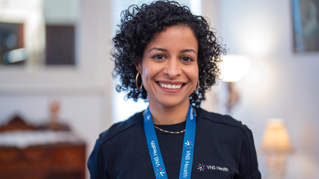 vns health female team member with blue shirt smiling