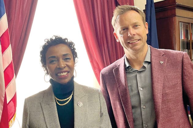 yvette clark and dan savitt smiling together