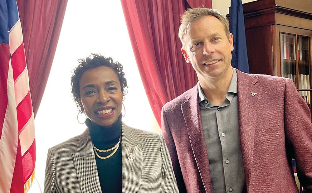 yvette clark and dan savitt smiling together