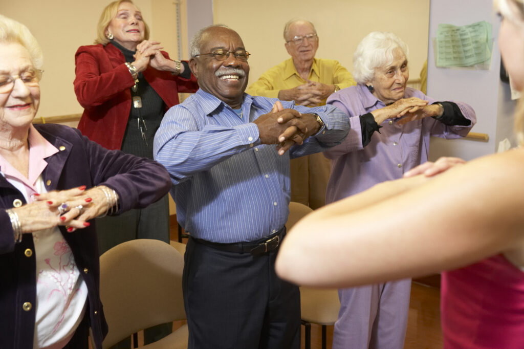 group of seniors participating in a exercise class