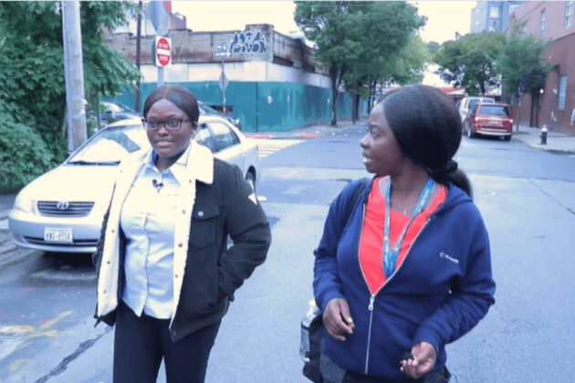 two VNS Health team members talking and walking down the street