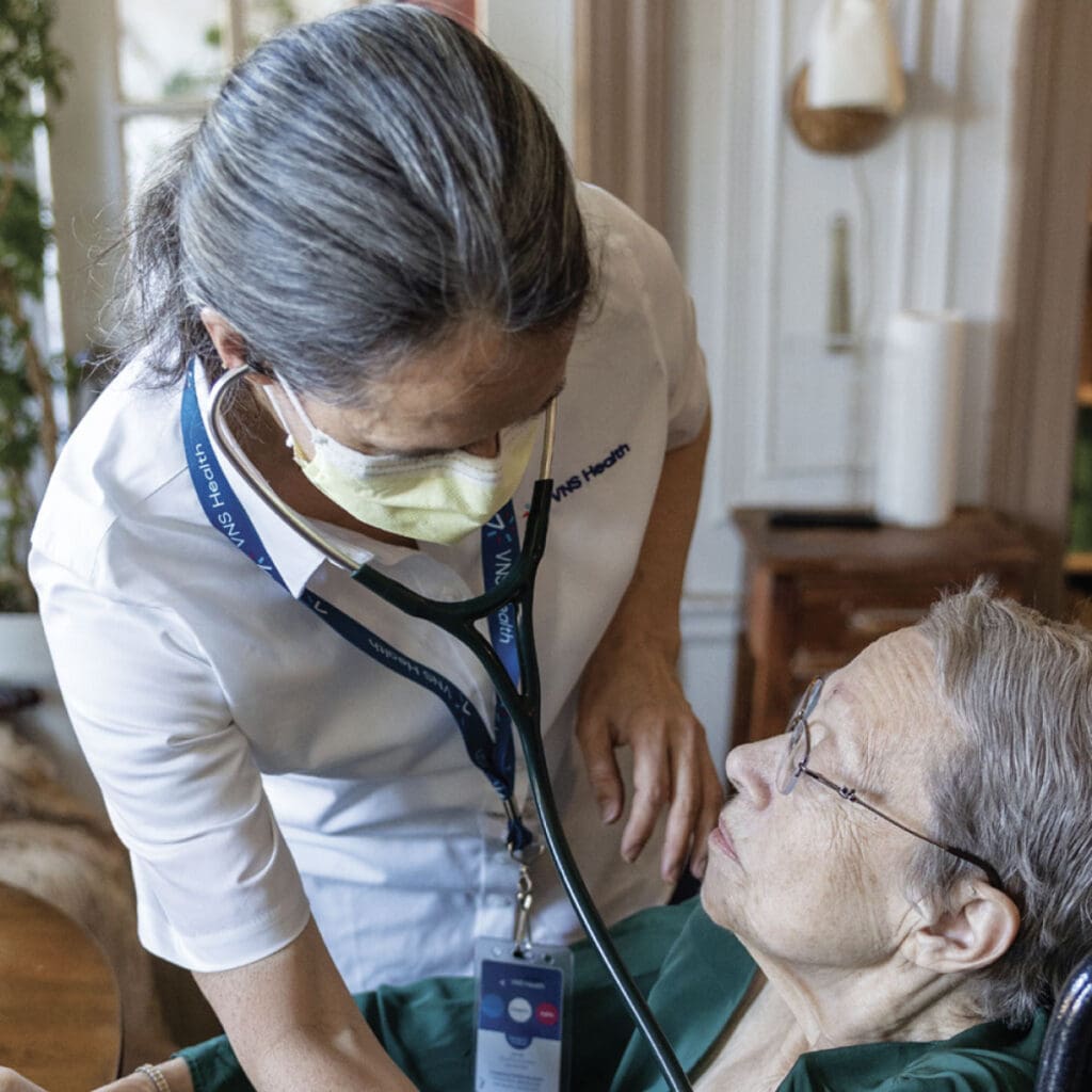 VNS Health team member checking older patient